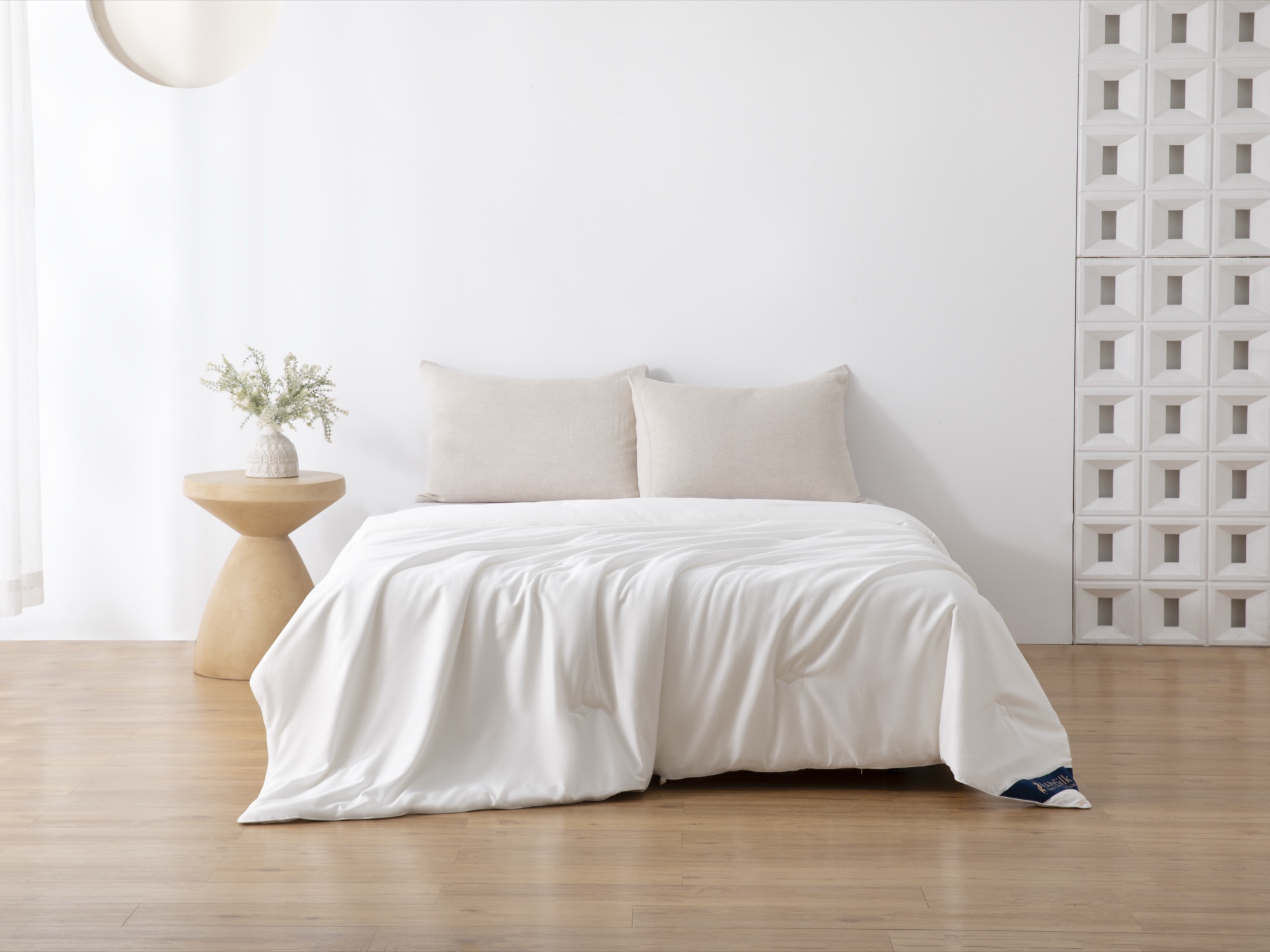 AuraSilk silk comforter in a bright bedroom